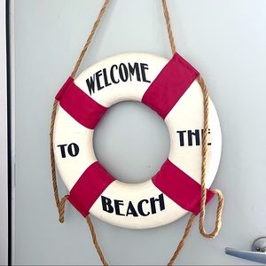 Life saver “Welcome to the beach” sign